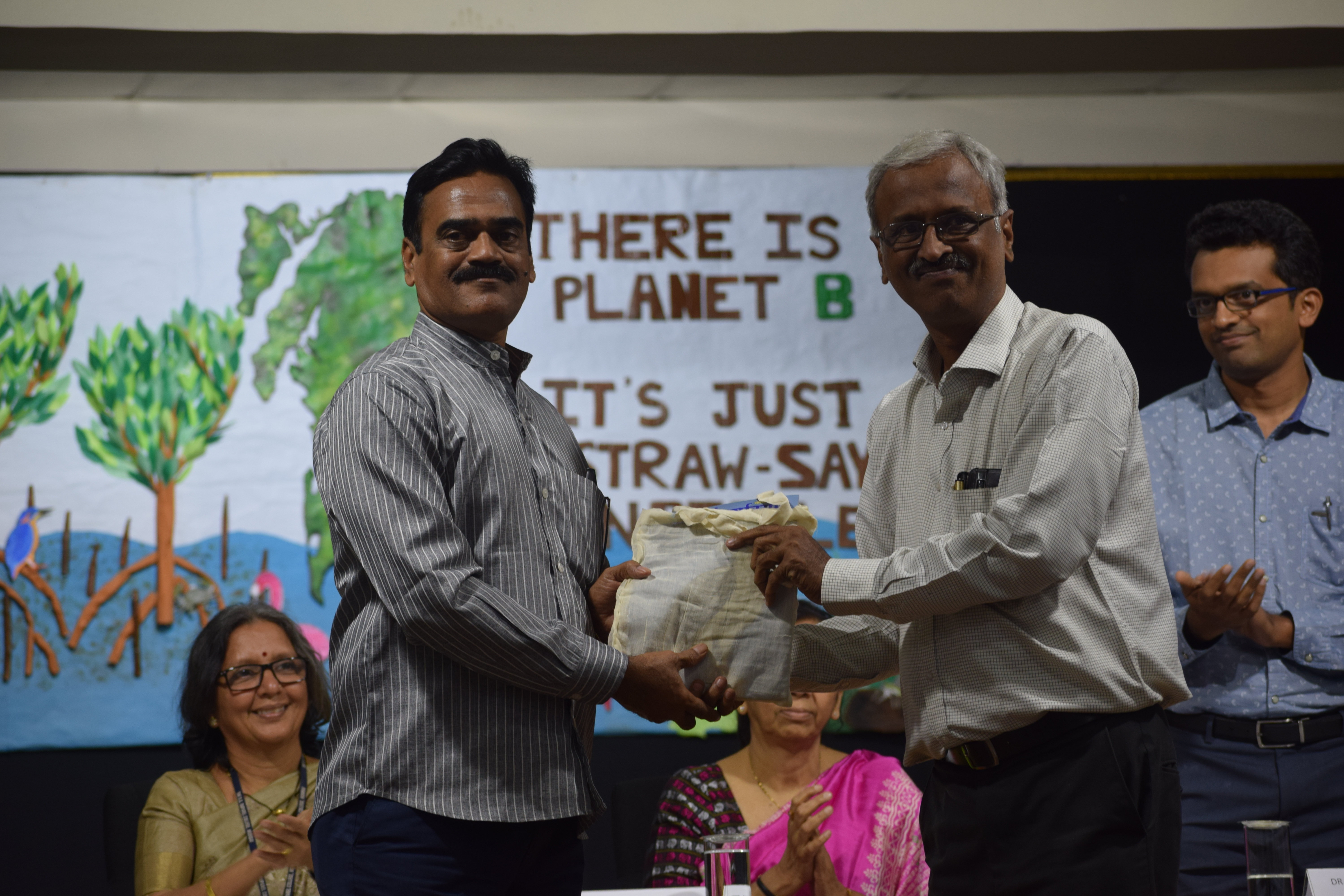 WETLAND AND MANGROVE ACTIVIST MR. NANDKUMAR PAWAR BEING FELICITATED (1).JPG