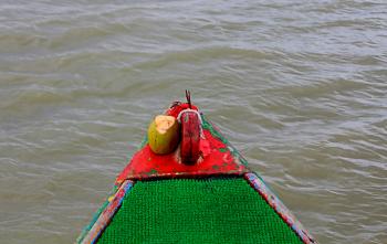 Prayers offered to the river and the boat before setting out in the mangroves of Sundarbans.